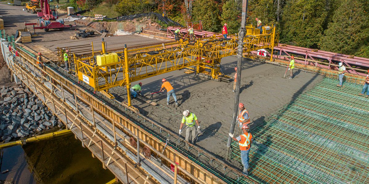Workers building a bridge